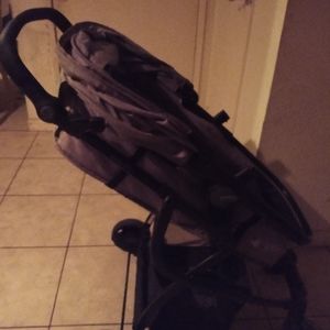 Baby stroller.black.A bunch of VHS tapes.. and a mongoose scooter